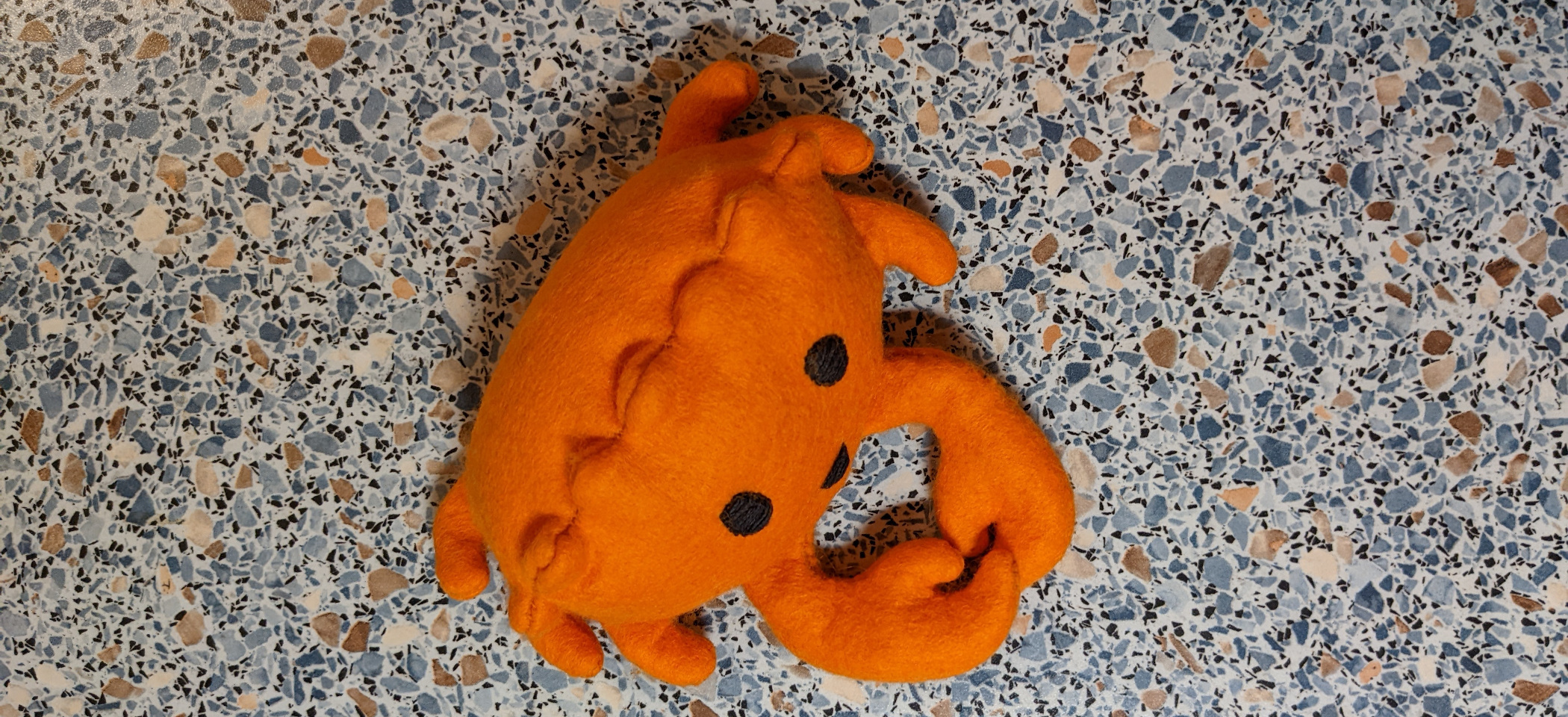 A plush crab of rust's mascot ferris